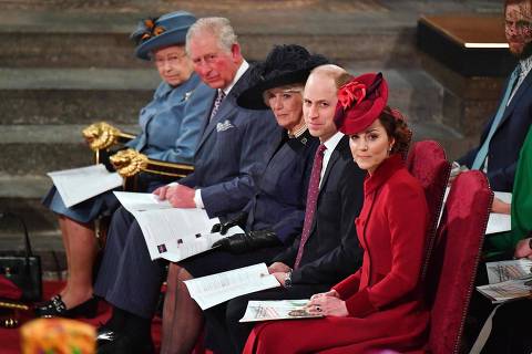 (FILES) In this file photo taken on March 09, 2020 (L-R) Britain's Queen Elizabeth II, Britain's Prince Charles, Prince of Wales, Britain's Camilla, Duchess of Cornwall, Britain's Prince William, Duke of Cambridge, and Britain's Catherine, Duchess of Cambridge sit inside Westminster Abbey as they attend the annual Commonwealth Service in London on March 9, 2020. - Senior members of Britain's royal family are to show a united front on March 7 praising the efforts of global health workers before the airing of a tell-all interview with Prince Harry and Meghan Markle. Just hours ahead of the screening of the interview, which has strained relations between the royals and sparked a transatlantic public relations war, Queen Elizabeth and other senior family members will appear in a programme celebrating the Commonwealth. (Photo by Phil HARRIS / POOL / AFP)