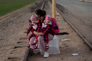 Migrants cross the border in Yuma, Arizona