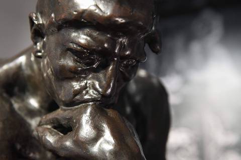 This photograph taken on June 28, 2022, shows a copy of Le Penseur (The Thinker), a sculpture by french artist Auguste Rodin (1840-1917) on display in Paris, that is scheduled to be auctioned at  Christie's auction house in the French capital on June 30. (Photo by ALAIN JOCARD / AFP) ORG XMIT: 407