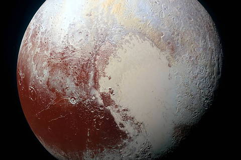 FILE PHOTO: A heart shaped region named Sputnik Planum is seen in an enhanced view of Pluto in an undated image from NASA's New Horizons spacecraft, which flew past the dwarf planet in 2015. REUTERS/NASA/JHUAPL/SwRI/Handout via Reuters  THIS IMAGE HAS BEEN SUPPLIED BY A THIRD PARTY. IT IS DISTRIBUTED, EXACTLY AS RECEIVED BY REUTERS, AS A SERVICE TO CLIENTS. FOR EDITORIAL USE ONLY. NOT FOR SALE FOR MARKETING OR ADVERTISING CAMPAIGNS/File Photo ORG XMIT: FW1
