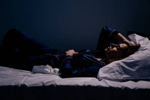 Sad alone woman lying the bed. Insomnia concept. (Credit:Burdun/Adobe Stock )