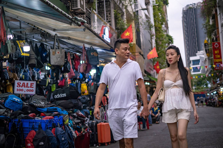 Jeffrey Chue and his wife Nguyen Thi Anh Thy in Ho Chi Minh City, Vietnam, Jan. 27, 2023. The couple, who created a Telegram account for subscribers where they posted risqu videos and photos of themselves while in Singapore, were convicted of violating the countryÕs nudity and obscenity laws, and of obstructing justice, and fined $17,000. (Linh Pham/The New York Times)