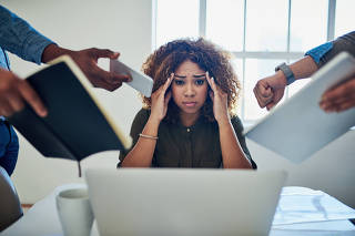 Can I get a moment to breathe. Shot of a stressed out young woman working in a demanding career.