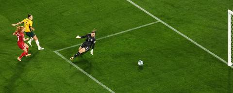 Australia's forward #09 Caitlin Foord scores a goal past Denmark's goalkeeper #01 Lene Christensen during the Australia and New Zealand 2023 Women's World Cup round of 16 football match between Australia and Denmark at Stadium Australia in Sydney on August 7, 2023. (Photo by DAVID GRAY / AFP)