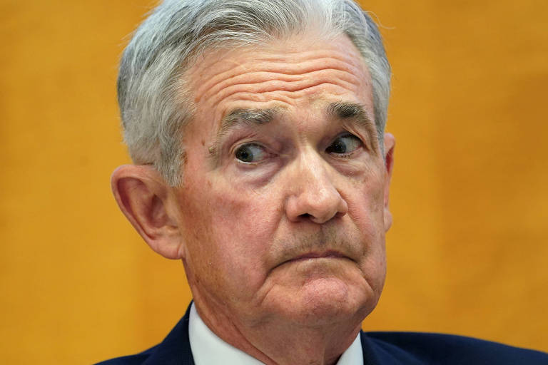 Jerome Powell, presidente do Fed, reage durante evento do FMI