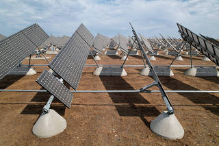 FILE PHOTO: Solar panels are set up in the solar farm at the University of California, Merced, in Merced, California, U.S. August 17, 2022. REUTERS/Nathan Frandino/