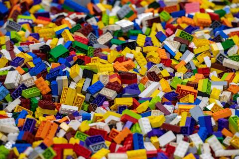 (FILES) Bricks of all sizes fill a pool at Brick Fest Live in Worcester, Massachusetts on October 21, 2023. Toy giant Lego and videogame leader Epic Games joined forces December 7, 2023 to launch 