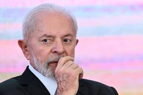 Brazilian President Luiz Inacio Lula da Silva gestures during the announcement of support measures for the storm-ravaged state of Rio Grande do Sul at the Planalto Palace in Brasilia on May 9, 2024. Some 400 municipalities have been affected by the worst natural calamity ever to hit the state of Rio Grande do Sul, with hundreds of people injured and more than 160,000 forced from their homes. (Photo by EVARISTO SA / AFP)
