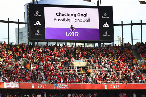 Soccer Football - Premier League - Arsenal v Everton - Emirates Stadium, London, Britain - May 19, 2024  The big screen displays a VAR review message leading to Arsenal's second goal Action Images via Reuters/Paul Childs EDITORIAL USE ONLY. NO USE WITH UNAUTHORIZED AUDIO, VIDEO, DATA, FIXTURE LISTS, CLUB/LEAGUE LOGOS OR 'LIVE' SERVICES. ONLINE IN-MATCH USE LIMITED TO 120 IMAGES, NO VIDEO EMULATION. NO USE IN BETTING, GAMES OR SINGLE CLUB/LEAGUE/PLAYER PUBLICATIONS. PLEASE CONTACT YOUR ACCOUNT REPRESENTATIVE FOR FURTHER DETAILS..