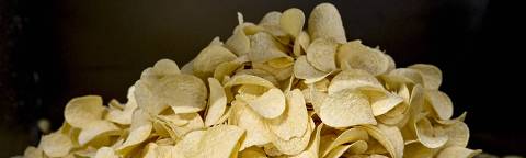 This photograph shows potato chips at the production site of the Pringles potato chips, where a new recyclable paper version of the trademark tube container will be produced, in Mechelen on May 3, 2023. (Photo by DIRK WAEM / Belga / AFP) / Belgium OUT