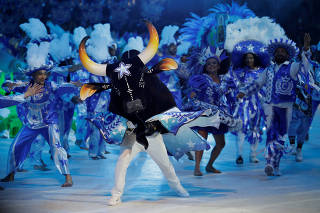 Revellers perform during the Parintins folklore festival in Parintins