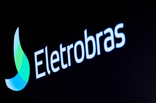 FILE PHOTO: The logo for Eletrobras, a Brazilian electric utilities company, is displayed on a screen on the floor at the NYSE in New York