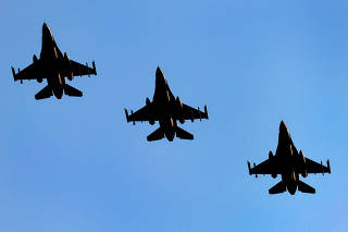 FILE PHOTO: F-16 fighter jets fly above Volkel Air Base in Netherlands