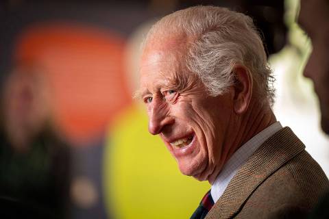 Britain's King Charles III reacts during a visit to the Forsinard Flows Visitor Centre in Forsinard, north Scotland on July 31, 2024, where he met with Flow Country Partnership staff, local residents, families and young people. Forsinard Flows, recently awarded UNESCO World Heritage Site Status, with the Flow Country widely considered to be the largest area of blanket bog in the world covering about 1,500 square miles in the Highlands. (Photo by Jane Barlow / POOL / AFP)