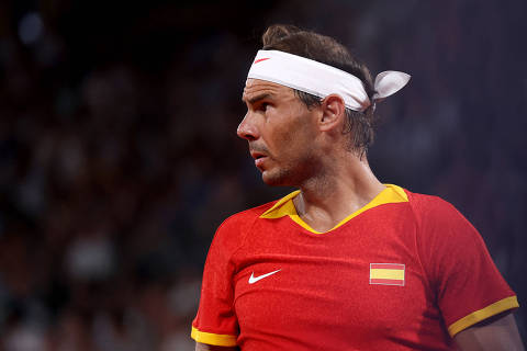 Paris 2024 Olympics - Tennis - Men's Doubles Quarterfinals - Roland-Garros Stadium, Paris, France - July 31, 2024. Rafael Nadal of Spain reacts during his match with Carlos Alcaraz of Spain against Austin Krajicek of United States and Rajeev Ram of United States. REUTERS/Claudia Greco