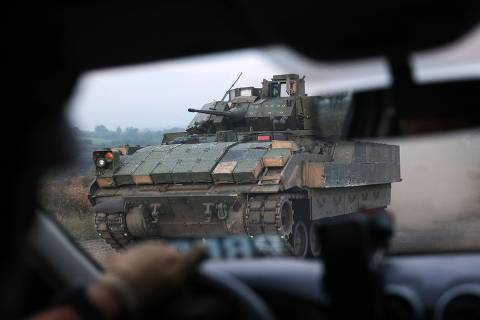 TOPSHOT - The Ukrainian BMP Bradley rides on a road not far from the town of Toretsk, Donetsk region, on July 29, 2024, amid the Russian invasion in Ukraine. (Photo by Anatolii STEPANOV / AFP)