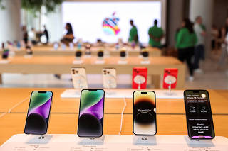 FILE PHOTO: Apple iPhones are seen inside India's first Apple retail store, a day ahead of its launch, in Mumbai