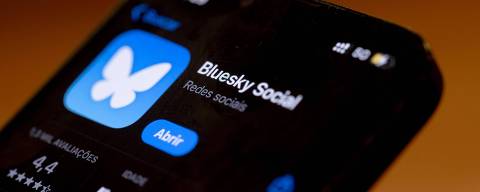 In this photo illustration, the Bluesky Social logo is displayed on a cell phone in Rio de Janeiro, Brazil, on September 4, 2024. Bluesky, a social network that works similarly to X (formerly Twitter), had registered more than 2 million new users, driven by a large influx from Brazil by September 2nd. The increase in migration has made Portuguese the most widely spoken language on the platform, the company told AFP. This is yet another chapter in a series of clashes between billionaire Elon Musk, owner of X, and Supreme Court Justice Alexandre de Moraes, who ordered the social network to be blocked on August 30 after Musk failed to comply with a request to present a legal representative in Brazil. The blocking of X in Brazil was accompanied by an intense digital migration to other platforms, as is also the case with Threads. (Photo by MAURO PIMENTEL / AFP)