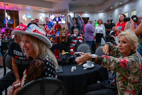 Supporters of US former President and 2024 Republican presidential candidate Donald Trump attend a watch party for the US Presidential debate between Trump and Vice President and Democratic presidential candidate Kamala Harris in West Palm Beach, Florida, on September 10, 2024. (Photo by Giorgio VIERA / AFP)