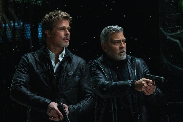 Brad Pitt e George Clooney em cena de 'Lobos'