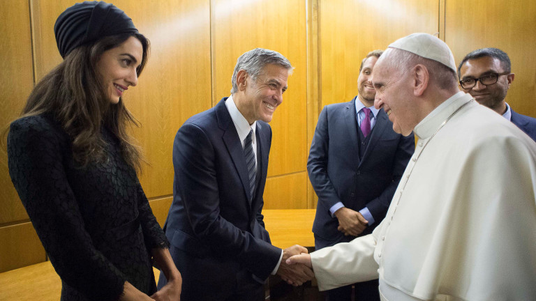 Pope Francis meets US actor Clooney and his wife Amal during a meeting of the Scholas Occurrentes at the Vatican