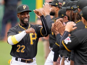 Pittsburgh Pirates' Andrew McCutchen high fives his teammates before a game