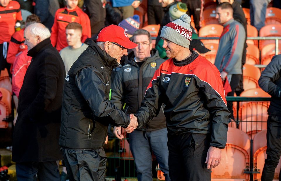 Tyrone manager Mickey Harte greets Down manager Paddy Tally in 2020.