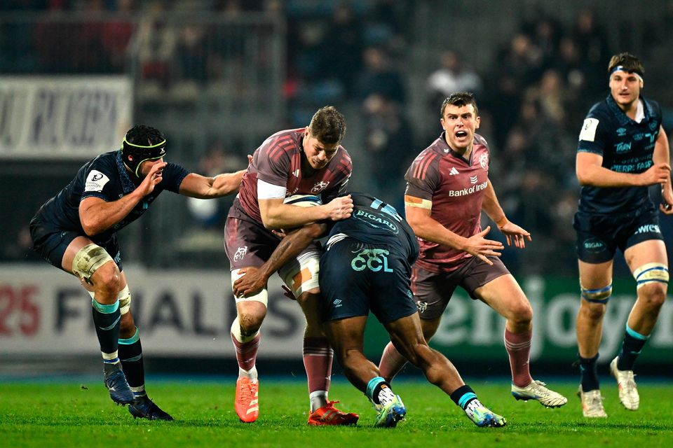 Munster's Jack O'Donoghue is tackled by Andrea Cocagi of Castres during the Champions Cup Pool 3 match at Stade Pierre Fabre in Castres, France. Photo: Brendan Moran/Sportsfile