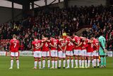 thumbnail: James McClean stood away from his Wrexham team-mates during the minute's silence on Remembrance weekend.