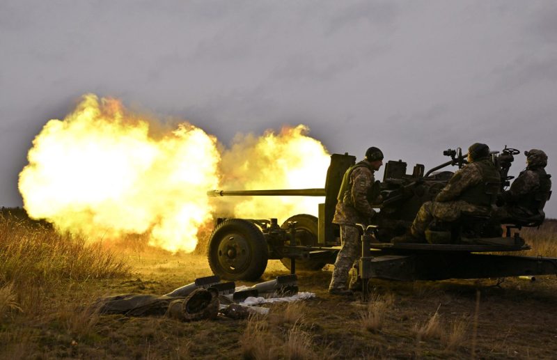 Ukrainian servicemen fire artillery during an anti-drone drill in Chernigiv oblast, Ukraine, on Nov. 11, 2023.