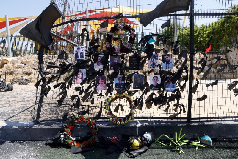 Portraits of children killed in a rocket attack on the Israeli-controlled Golan Heights, an attack attributed to Hezbollah, are hung up in Majdal Shams on July 29.