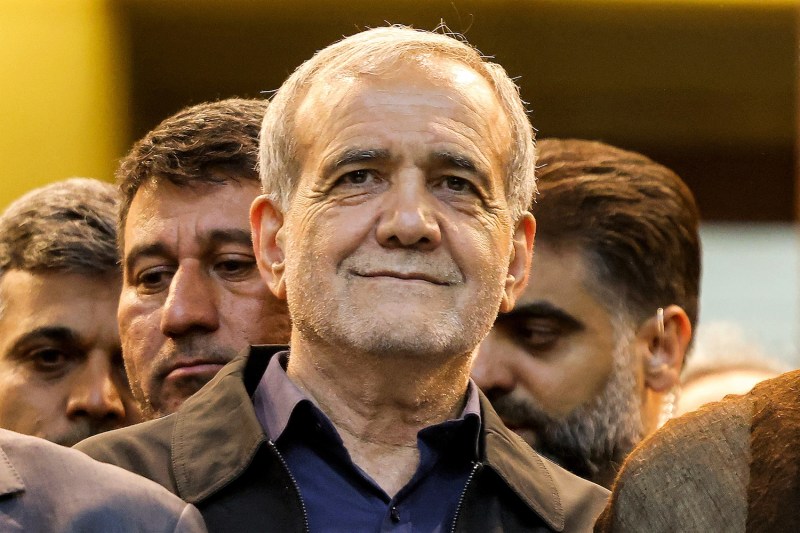 Iranian President-elect Masoud Pezeshkian smiles as he visit the Khomeini shrine in Tehran.