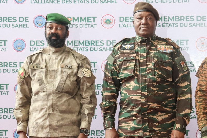 The head of head of Niger's military government General Abdourahmane Tchiani (R) and  Malian Col. Assimi Goita (L) pose for a photo as they arrive  in Niamey on July 6.