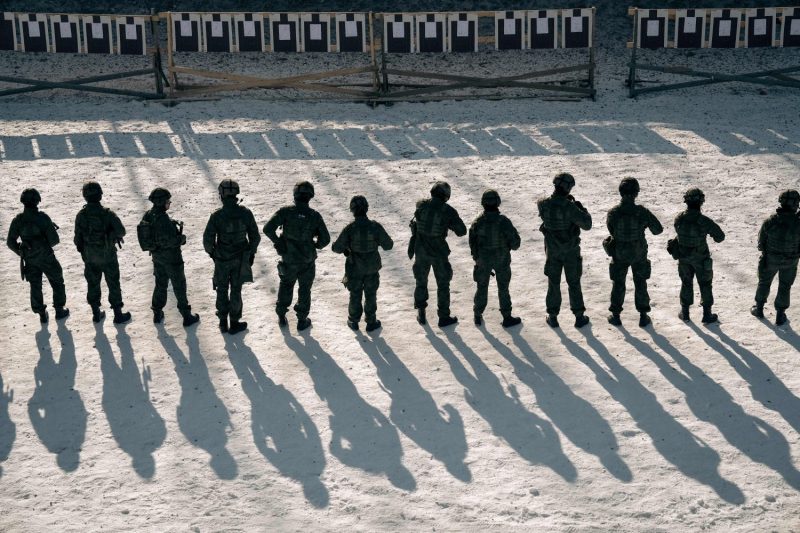 Finnish reservists of the Guard Jaeger Regiment stand at a shooting range at the Santahamina military base in Helsinki, Finland on March 7, 2023.