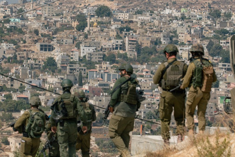 Israeli soldiers gather during a protest in the town of Beita in the occupied West Bank on July 26.