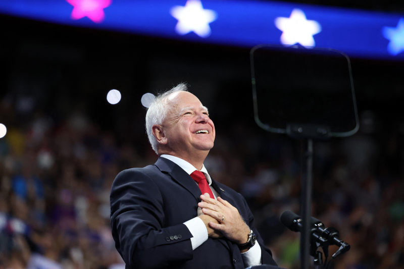 Democratic vice presidential candidate and Minnesota Gov. Tim Walz gestures during a campaign rally at the University of Nevada, Las Vegas.