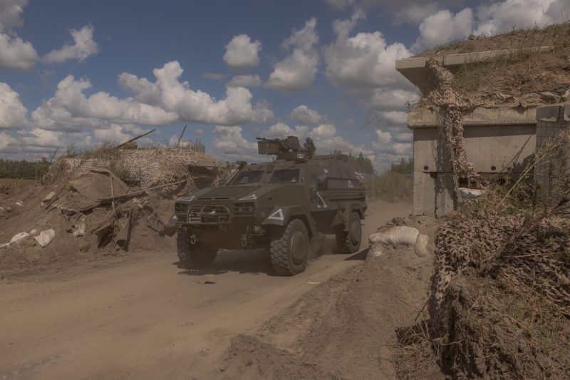 A Ukrainian military vehicle drives past a destroyed border checkpoint amid Ukraine’s surprise incursion into Russia, in the Sumy region, Ukraine, on Aug. 14.