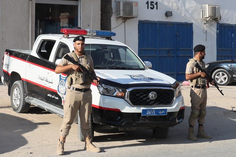 Libyan security forces stand guard during a handover ceremony in Tripoli on Aug. 26.