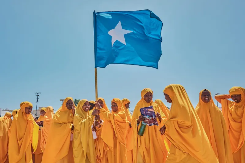 Students wave a Somali flag during a demonstration in support of Somalia's government following the port deal signed between Ethiopia and the breakaway region of Somaliland at Eng Yariisow Stadium in Mogadishu on Jan. 3.