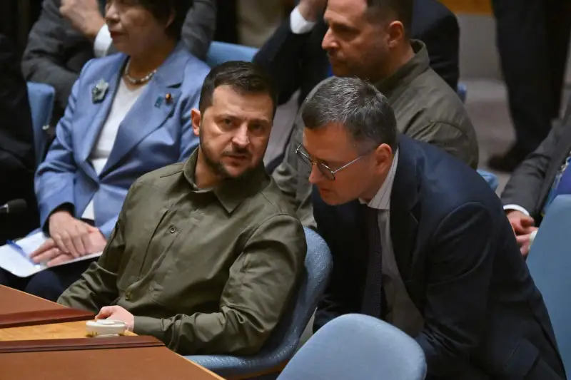 Ukrainian President Volodymyr Zelensky speaks with Foreign Minister Dmytro Kuleba during a high-level U.N. Security Council meeting.