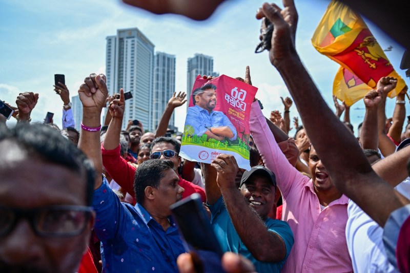 Supporters of newly elected Sri Lankan President Anura Kumara Dissanayake celebrate his swearing-in near the presidential secretariat in Colombo, Sri Lanka, on Sept. 23.