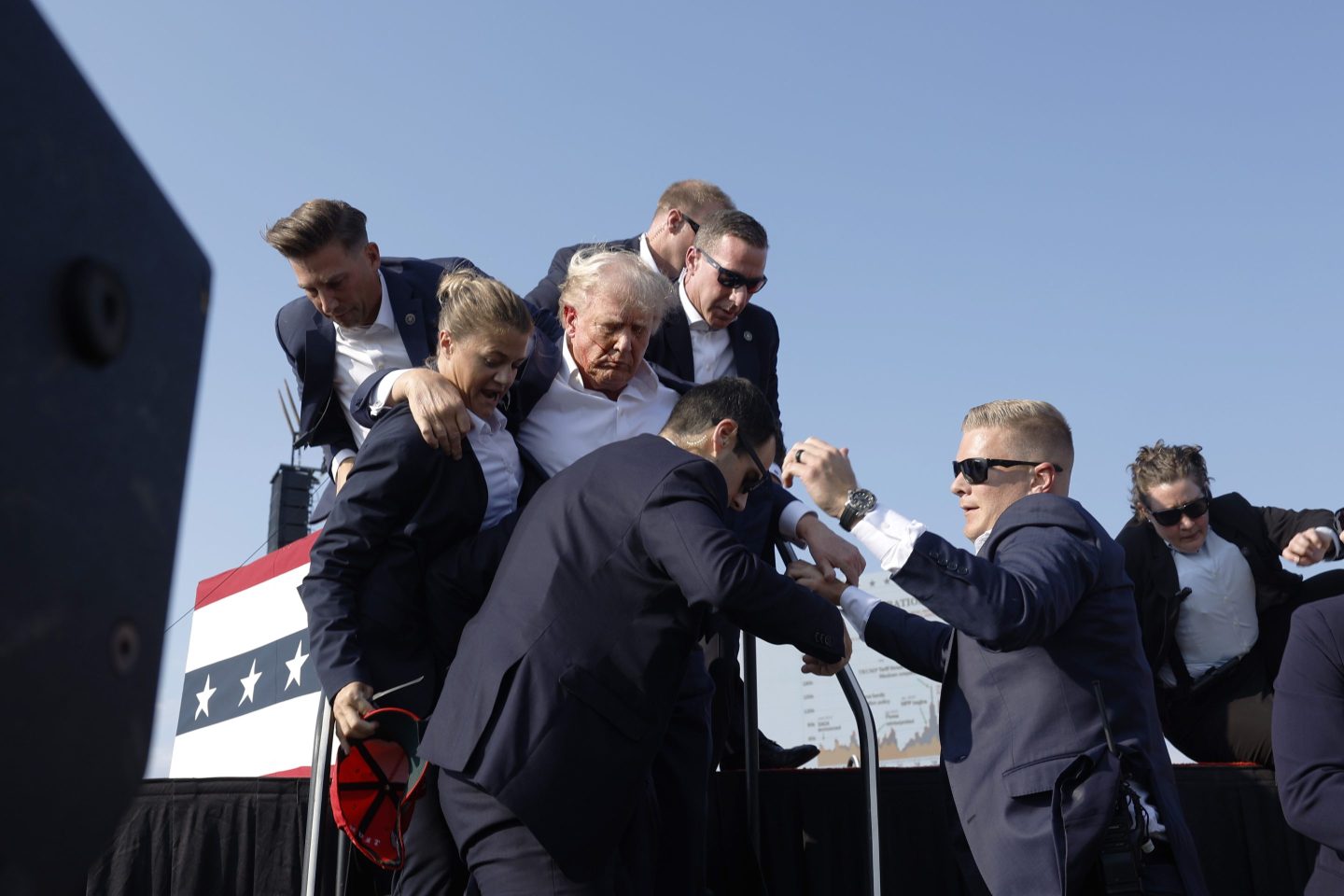 Republican presidential candidate former President Donald Trump is rushed offstage during a rally.