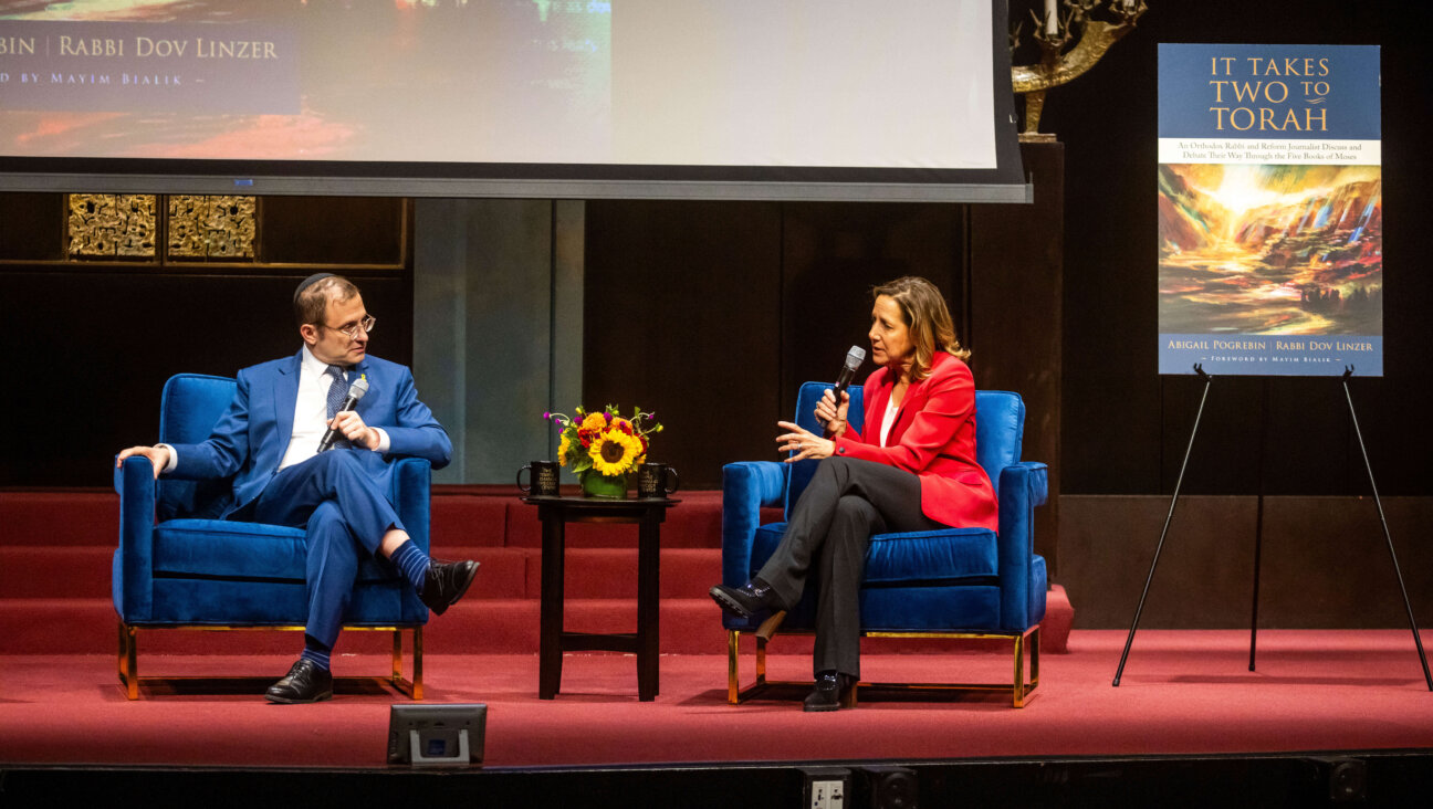 Rabbi Dov Linzer (left) and Abigail Pogrebin (right) speaking about their new book, "It Takes Two To Torah" at a launch event on Sept. 5. 