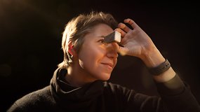 A person holding a view master and looking inside of it