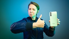 An editor holding the Samsung Galaxy A14 mimicking Brent Rambo meme