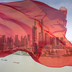 View of Pudong business district with a transparent Chinese flag superimposed.