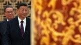 资料照：中国领导人习近平和总理李强步入北京人大会堂。（2024年6月28日）