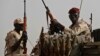 (FILE) Sudanese soldiers from the Rapid Support Forces secure an area in East Nile province, Sudan, June 22, 2019.