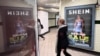 2024年3月8日，英国伦敦一名女子走过地铁走道旁希音的广告牌。（路透社照片）