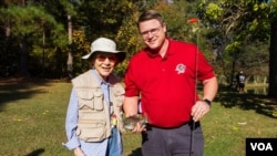 VOA correspondent Kane Farabaugh with former First Lady Rosalynn Carter. 